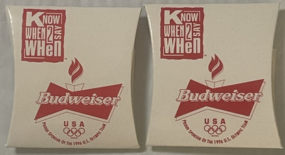 Two unopened Budweiser 1996 Olympics USA sewing kits with red and white packaging, shown front and angled view.