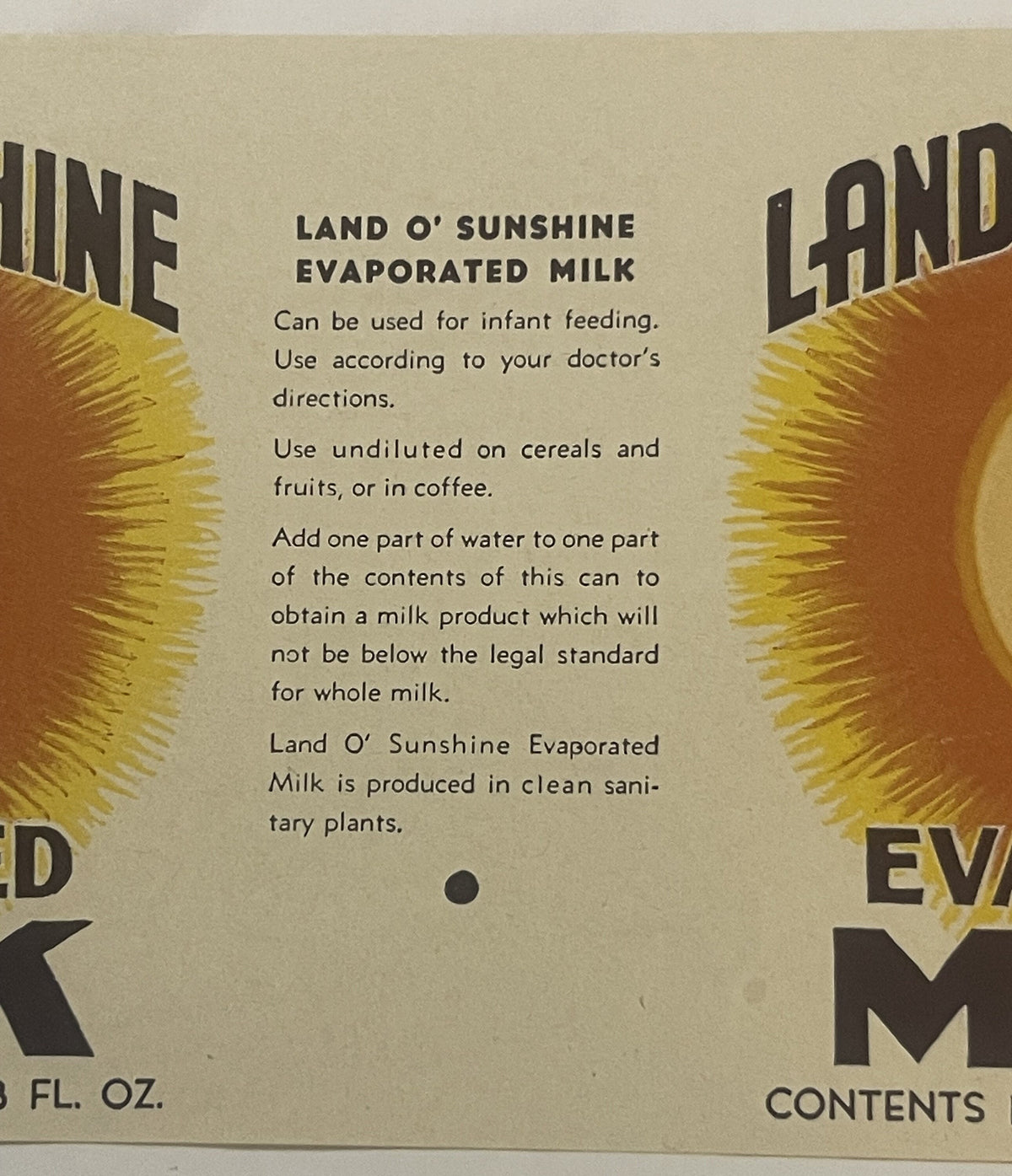 Close-up of the printed directions panel, headed Land O' Sunshine Evaporated Milk, between two sunburst panels