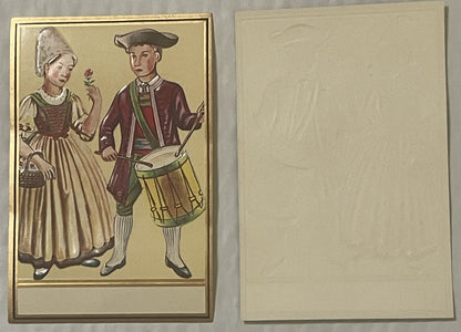 Antique gold-embossed label showing Pennsylvania Dutch couple in colonial dress, man with drum and woman with flower, front a