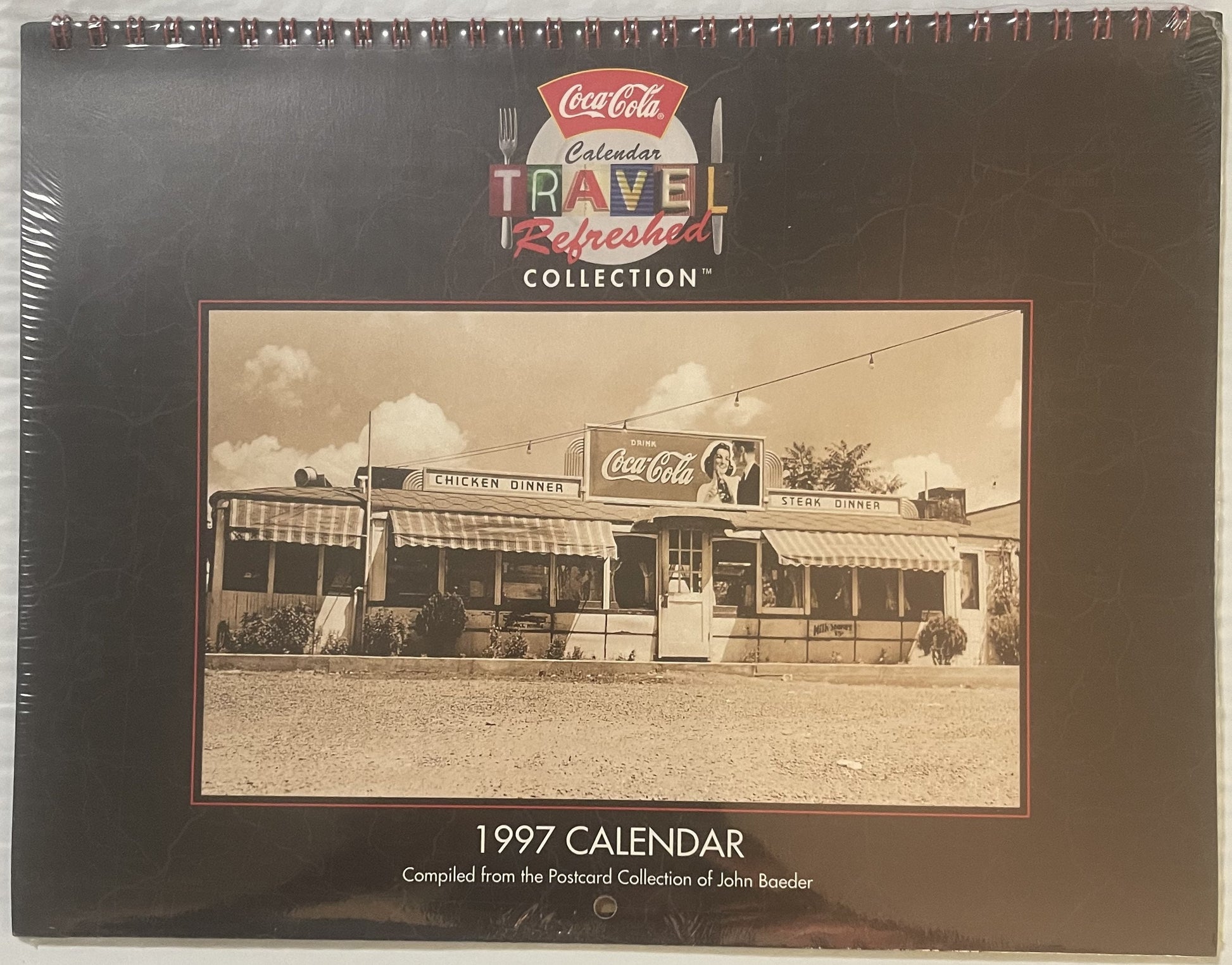Sealed 1997 Coca-Cola Travel Refreshed Collection calendar featuring vintage diner with Coca-Cola signage, spiral-bound with 