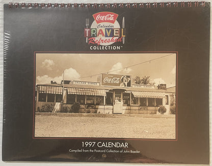 Sealed 1997 Coca-Cola Travel Refreshed Collection calendar featuring vintage diner with Coca-Cola signage, spiral-bound with 