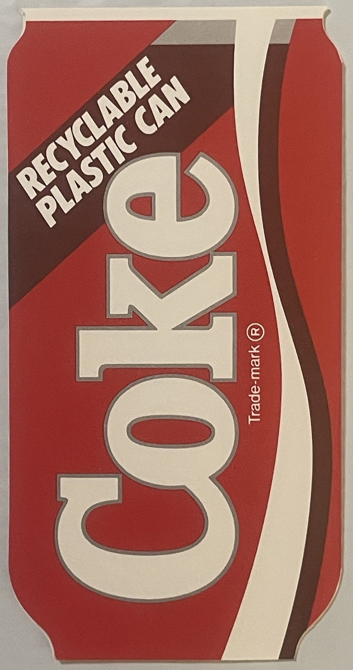Vintage red and cream die-cut Coca-Cola brochure for recyclable plastic can, featuring large white "Coke" lettering and brown