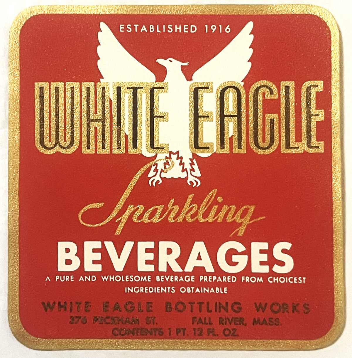 Vintage gold-embossed red beverage label featuring white eagle with spread wings, "White Eagle" text, and Fall River, Mass. b
