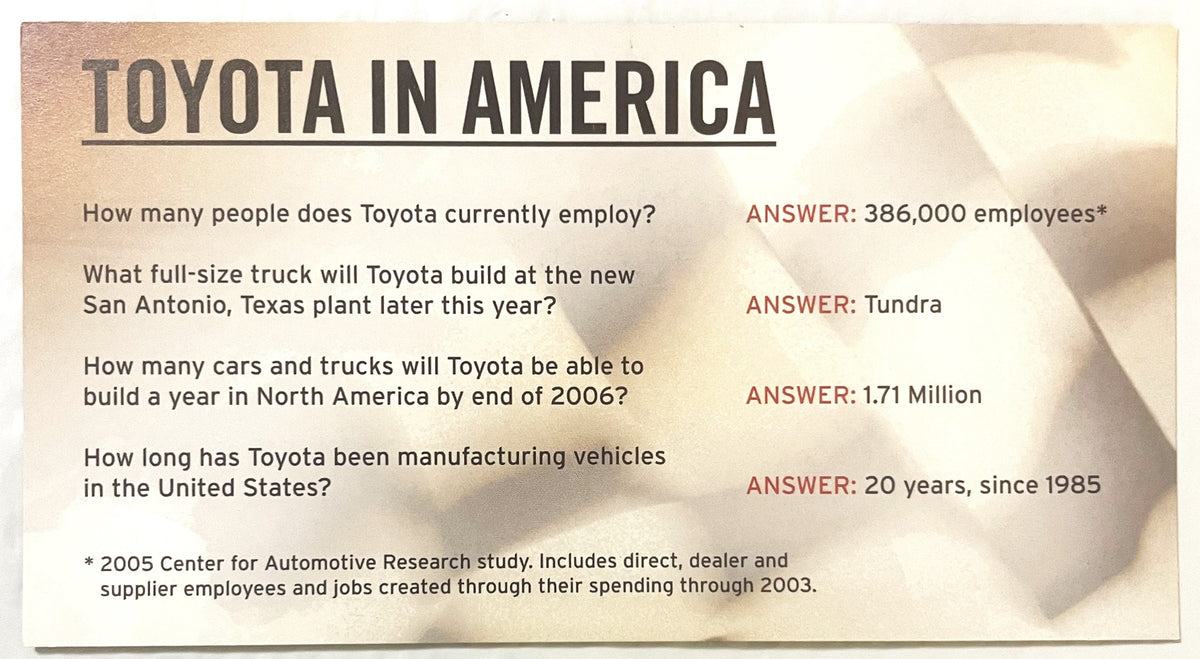 Beige informational card with "TOYOTA IN AMERICA" header listing employment numbers, truck models, and manufacturing