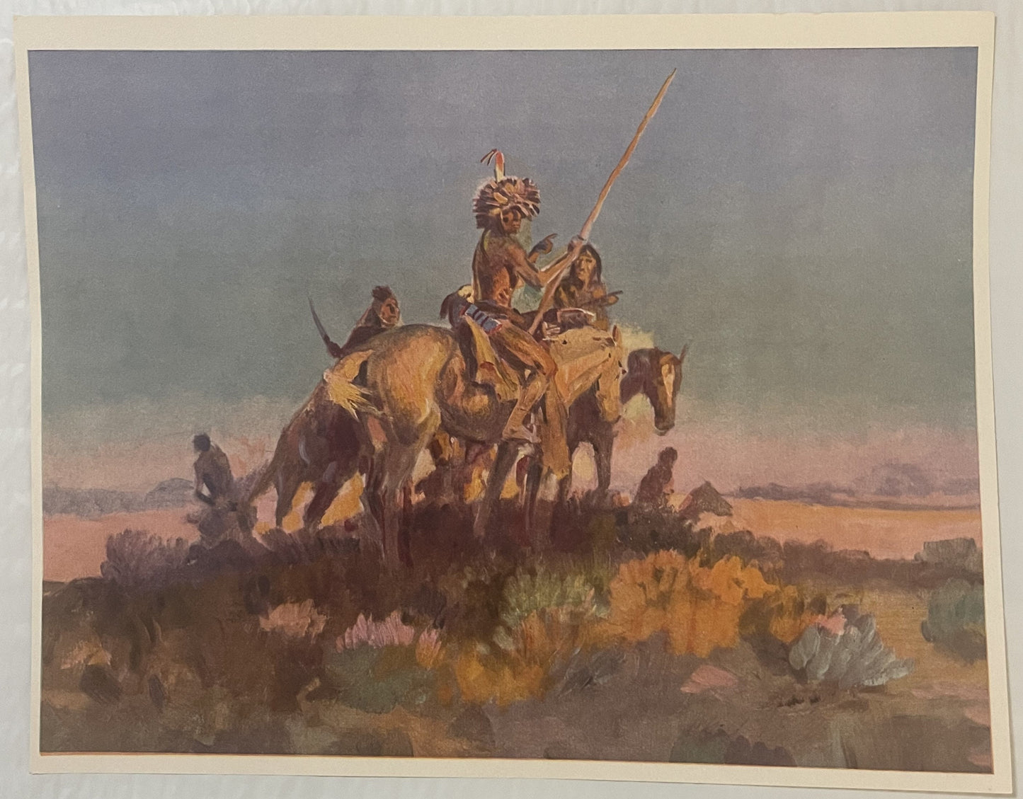 Vintage art print depicting Native American warriors on horseback with spears in desert landscape with sage brush, mounted on