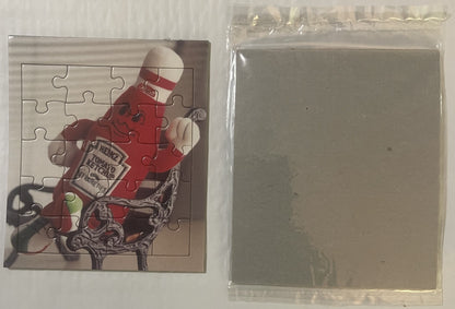 Vintage Heinz ketchup mascot puzzle showing red-suited character with striped hat, displayed next to clear plastic packaging 