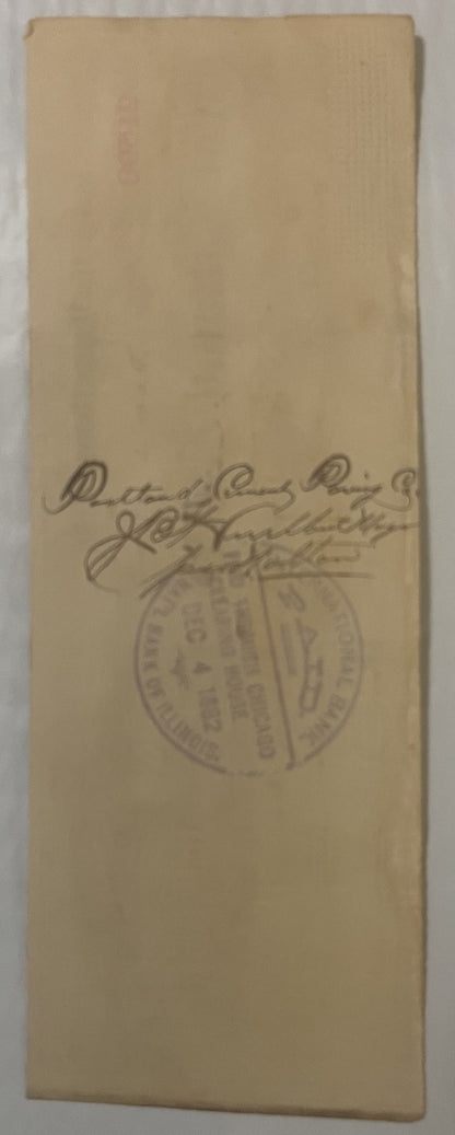 Cream-colored paper check with handwritten signature and circular stamp from Downer and Bemis Brewing Co., Chicago, photograp