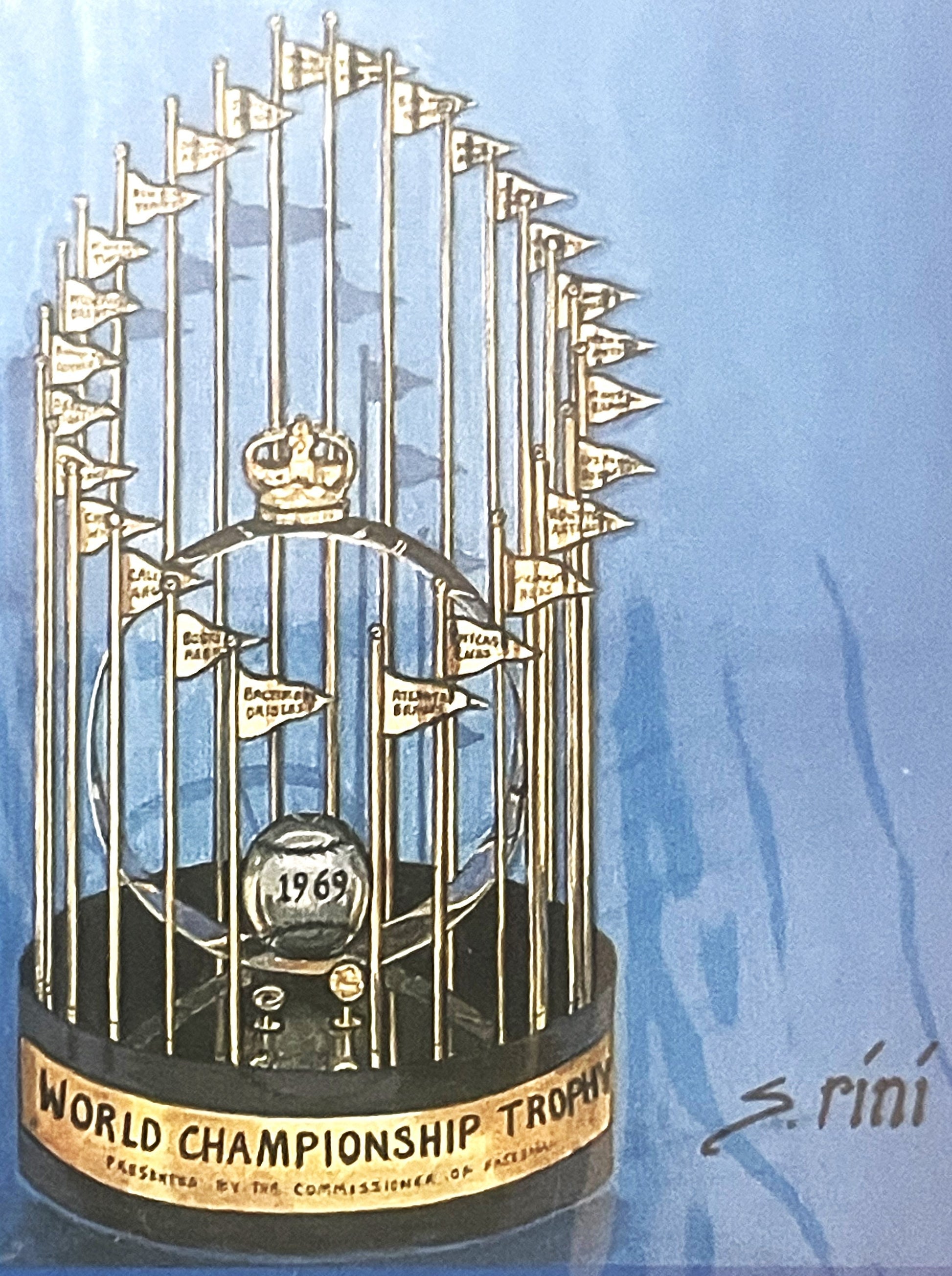 Gold and silver World Championship Trophy with 1969 date, crown top, and flags, on blue background with "S Pioni" signature v