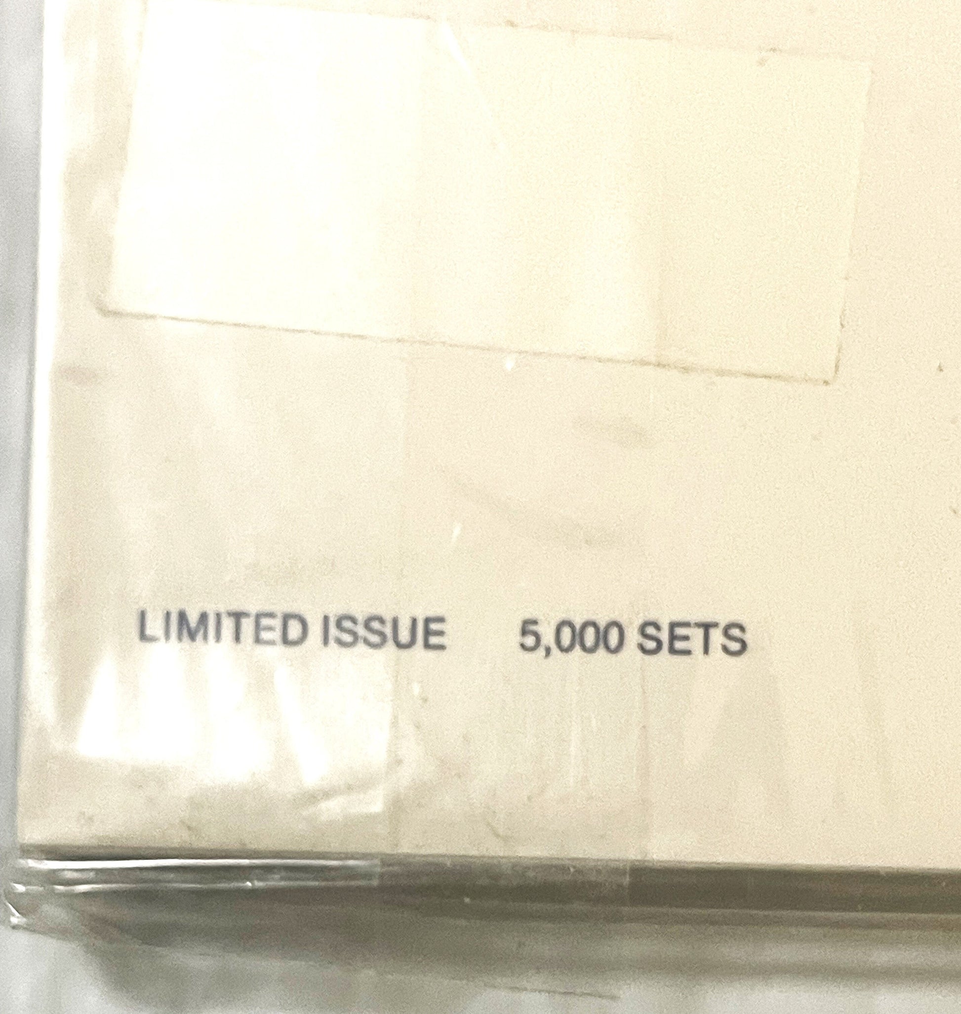 Close-up of packaging showing "LIMITED ISSUE 5,000 SETS" printed in gray text on cream-colored cardboard
