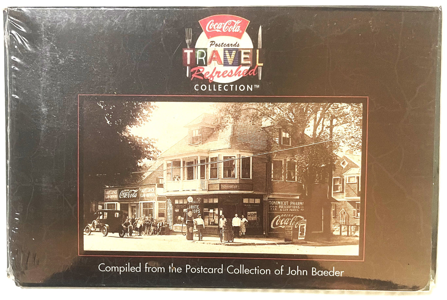 Sealed Coca-Cola "Travel Refreshed" postcard collection box featuring vintage sepia-toned storefront image with Coca-Cola sig