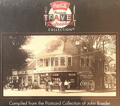 Sealed 1990s Coca-Cola "Travel Refreshed" postcard set box featuring vintage sepia-toned street scene with storefronts, pedes