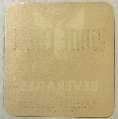 Cream-colored embossed label with faint printed text visible on surface, shown flat against white background