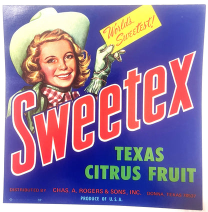 Vintage Sweetex Texas citrus fruit crate label featuring a smiling cowgirl in white hat holding a yellow banner reading "Worl