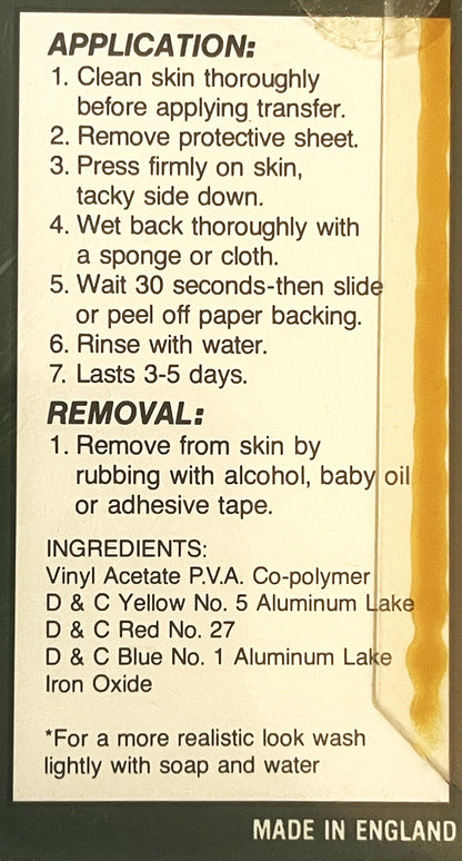 Back of vintage temporary tattoo package with application and removal instructions printed on cream-colored label, made in En