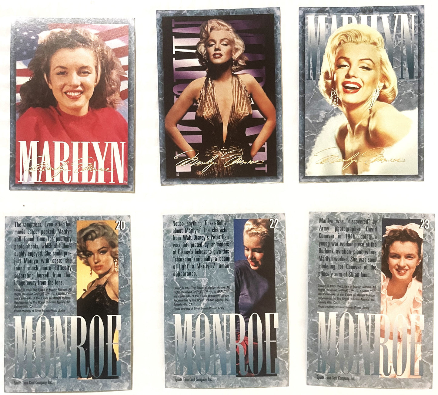 Six vintage 1993 Marilyn Monroe trading cards displayed, numbered 20-23, showing portraits with white text overlay and gray t