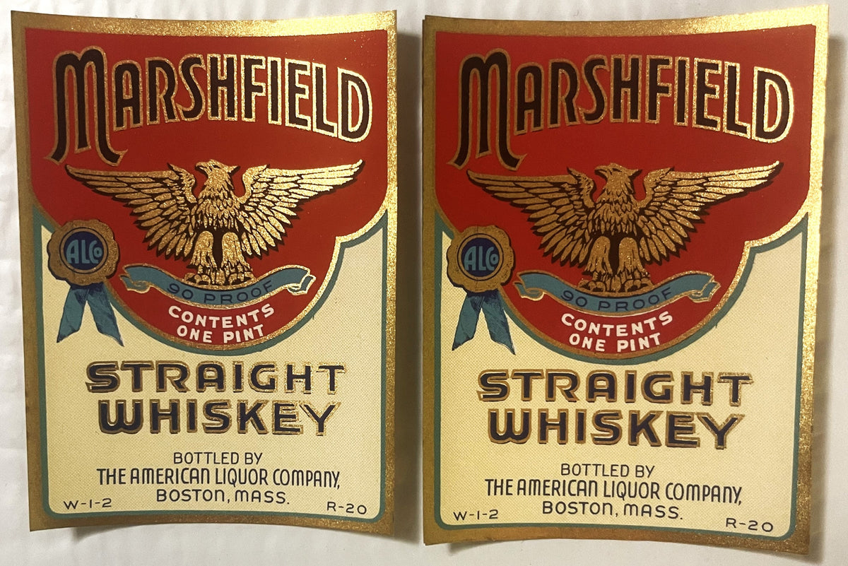 Two identical vintage Marshfield Straight Whiskey labels with gold eagle, red and cream colors, bottled by American Liquor Co