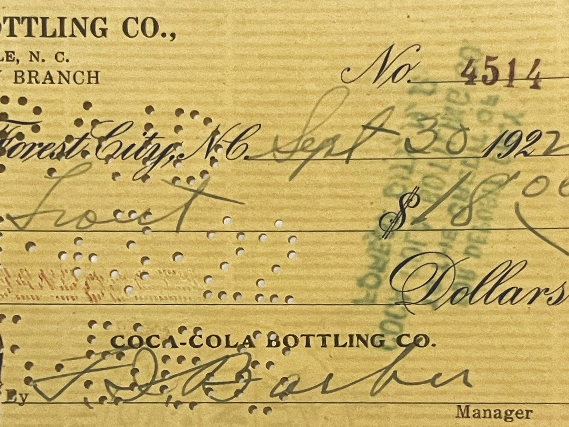 Aged bank check No. 4514 from Coca-Cola Bottling Co. Forest City Branch, dated 1921-1922, with handwritten signatures and dol