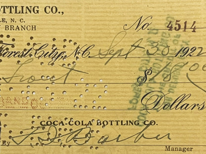 Aged bank check No. 4514 from Coca-Cola Bottling Co. Forest City Branch, dated 1921-1922, with handwritten signatures and dol