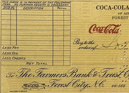 Vintage Coca-Cola bank check from Forest City, NC with blank line items, handwritten signature, and Federal Reserve System st