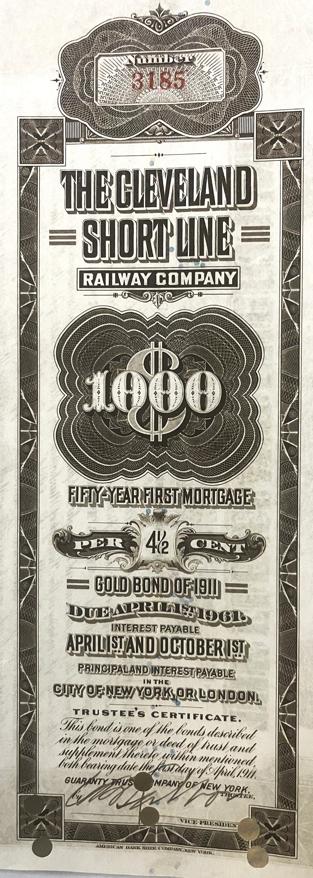 Antique 1911 Cleveland Short Line Railway $1000 gold bond certificate with ornate engraved borders and decorative text on age