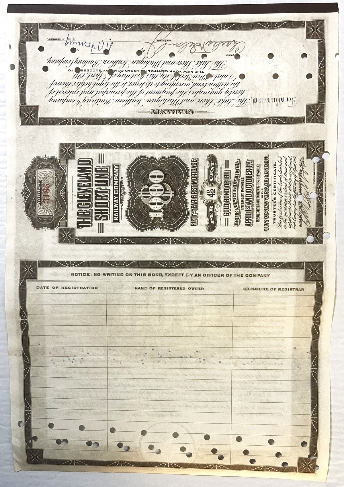 Antique bond certificate pages showing ornate black and white printed design with decorative borders, handwritten signatures,