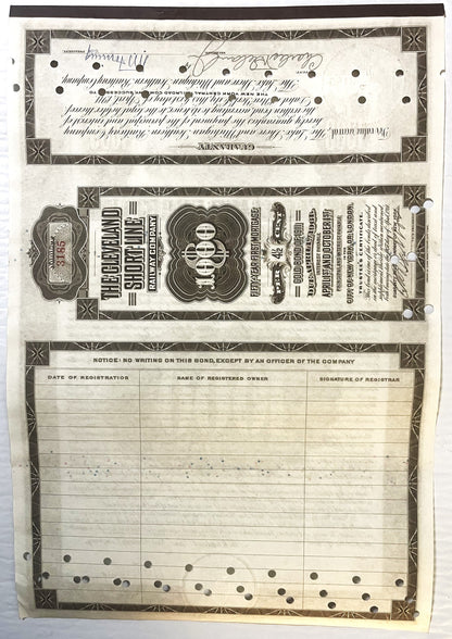 Antique bond certificate pages showing ornate black and white printed design with decorative borders, handwritten signatures,