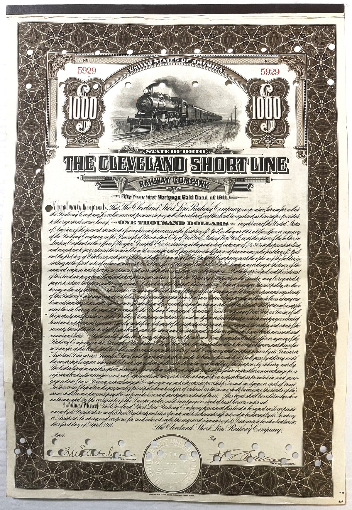 Antique 1911 Cleveland Short Line Railway $1000 gold bond certificate with steam locomotive vignette and coin shown for scale