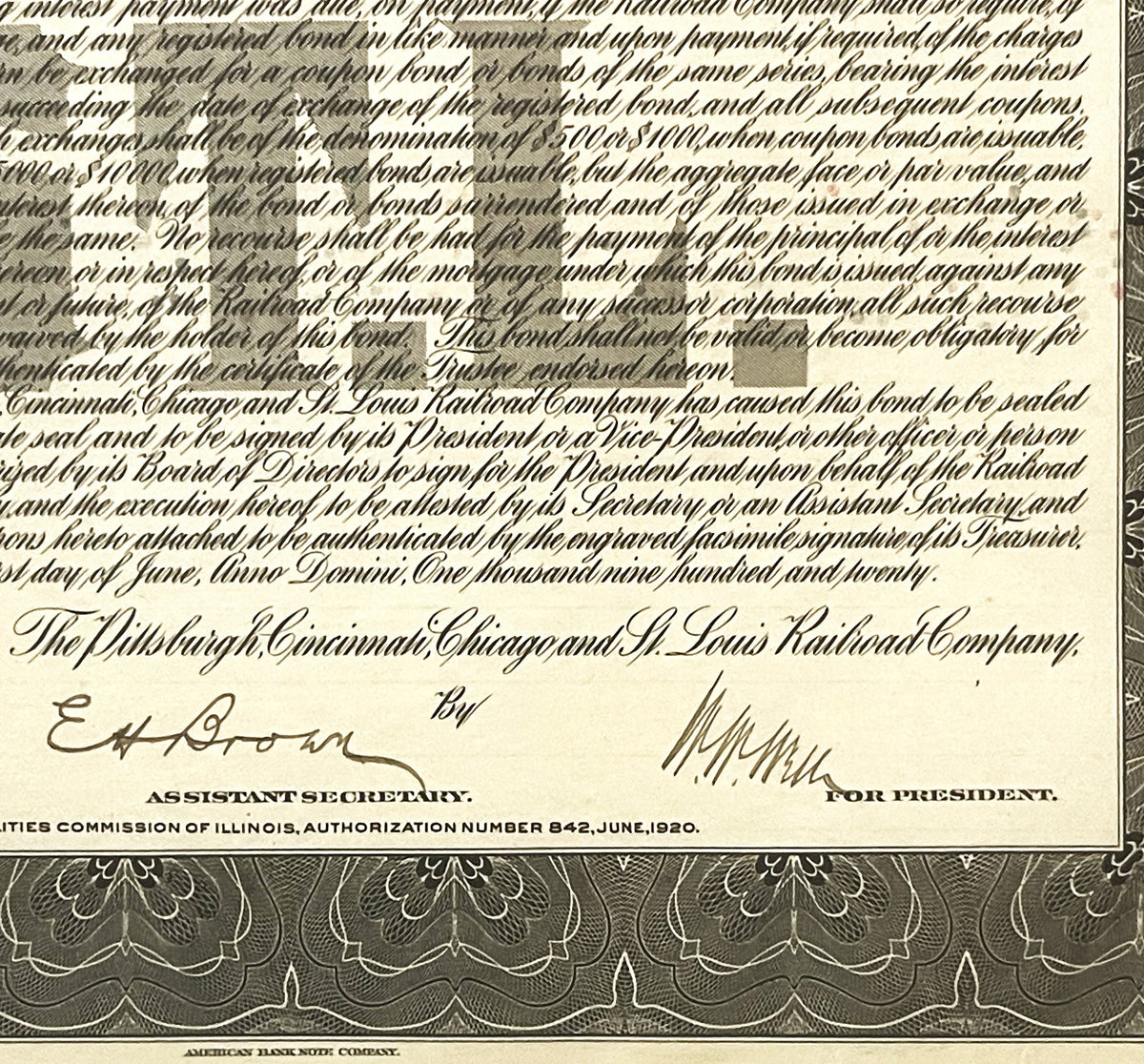 Close-up of 1920 railroad bond certificate showing ornate text, signatures, and decorative border in sepia tones