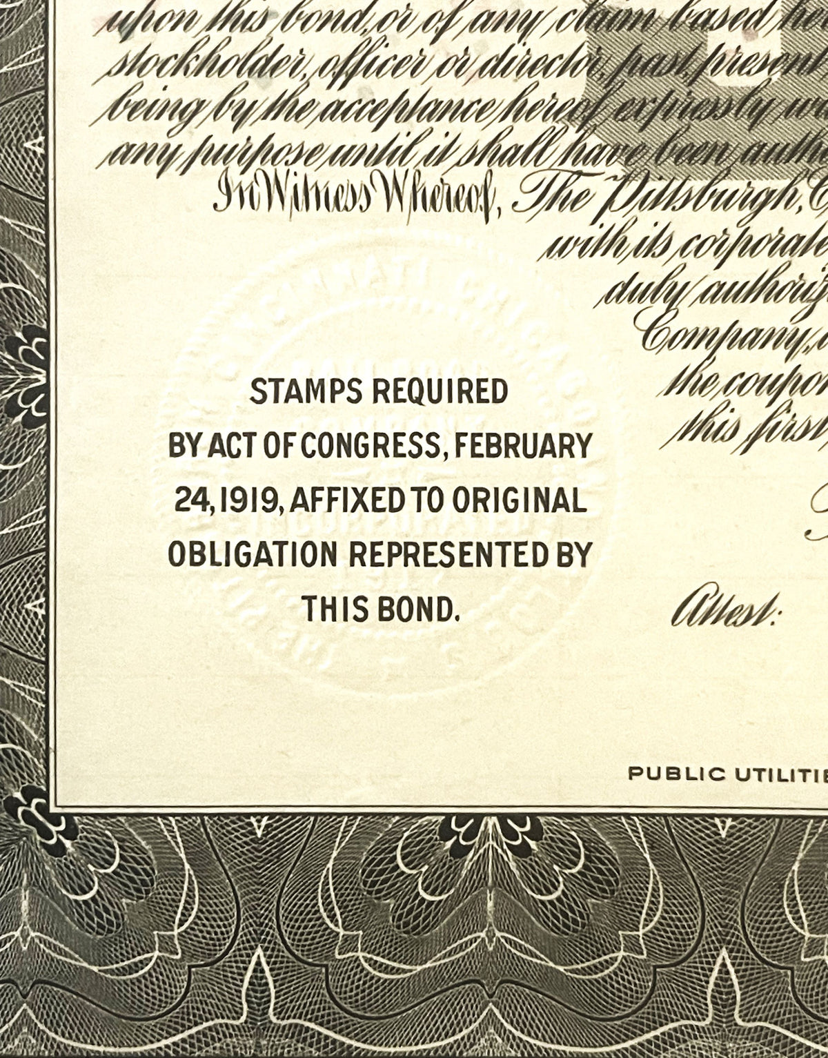 Close-up of vintage bond document showing printed text about stamps required by Act of Congress, February 24, 1919, with deco