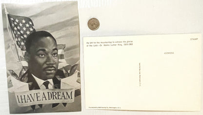 Vintage postcard featuring MLK portrait with American flag and "I HAVE A DREAM" text, shown front and back with quarter for s