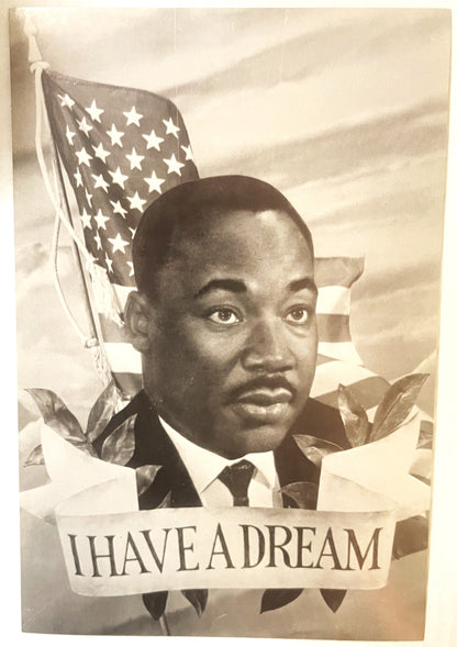 Sepia-toned vintage postcard featuring portrait of Martin Luther King Jr. with American flag and "I HAVE A DREAM" text banner