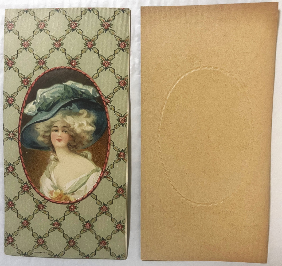 Antique chromolithograph candy box insert showing front and back: woman in large blue hat with plume on cream patterned backg