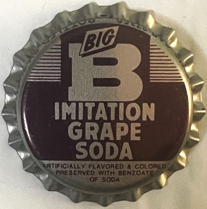 Vintage metal bottle cap with ridged edges, dark brown center featuring large "B" logo and "Big B Imitation Grape Soda" text,