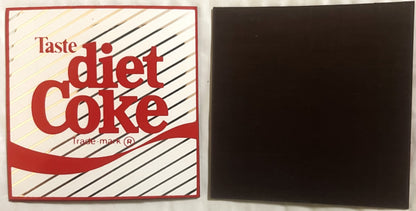 Vintage Diet Coke refrigerator magnet with red and white striped design and black back, displayed flat against white surface.