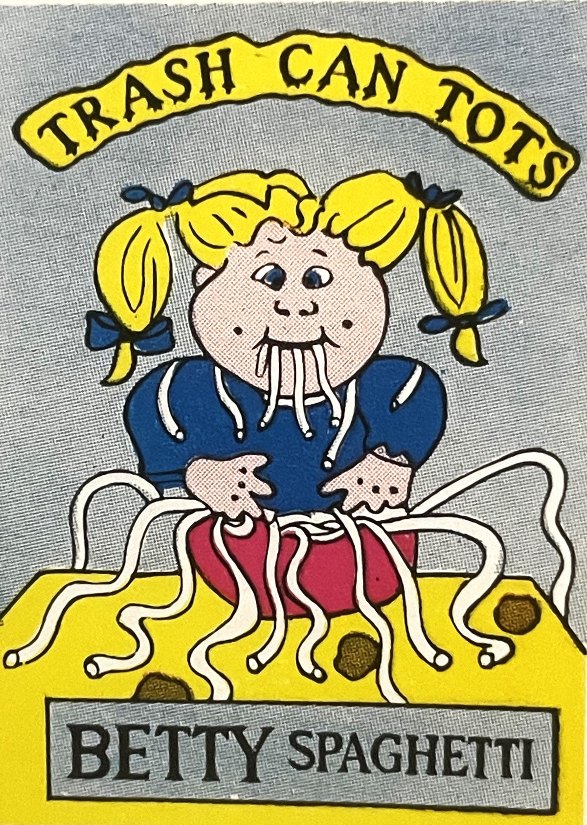 Vintage sticker featuring cartoon character with yellow pigtails eating spaghetti, labeled "Betty Spaghetti" with "Trash Can 