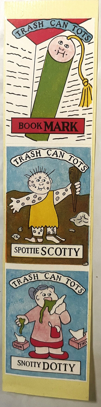 Three vintage "Trash Can Tots" sticker panels featuring cartoon characters: a green wrapped figure labeled "Book Mark," a spo