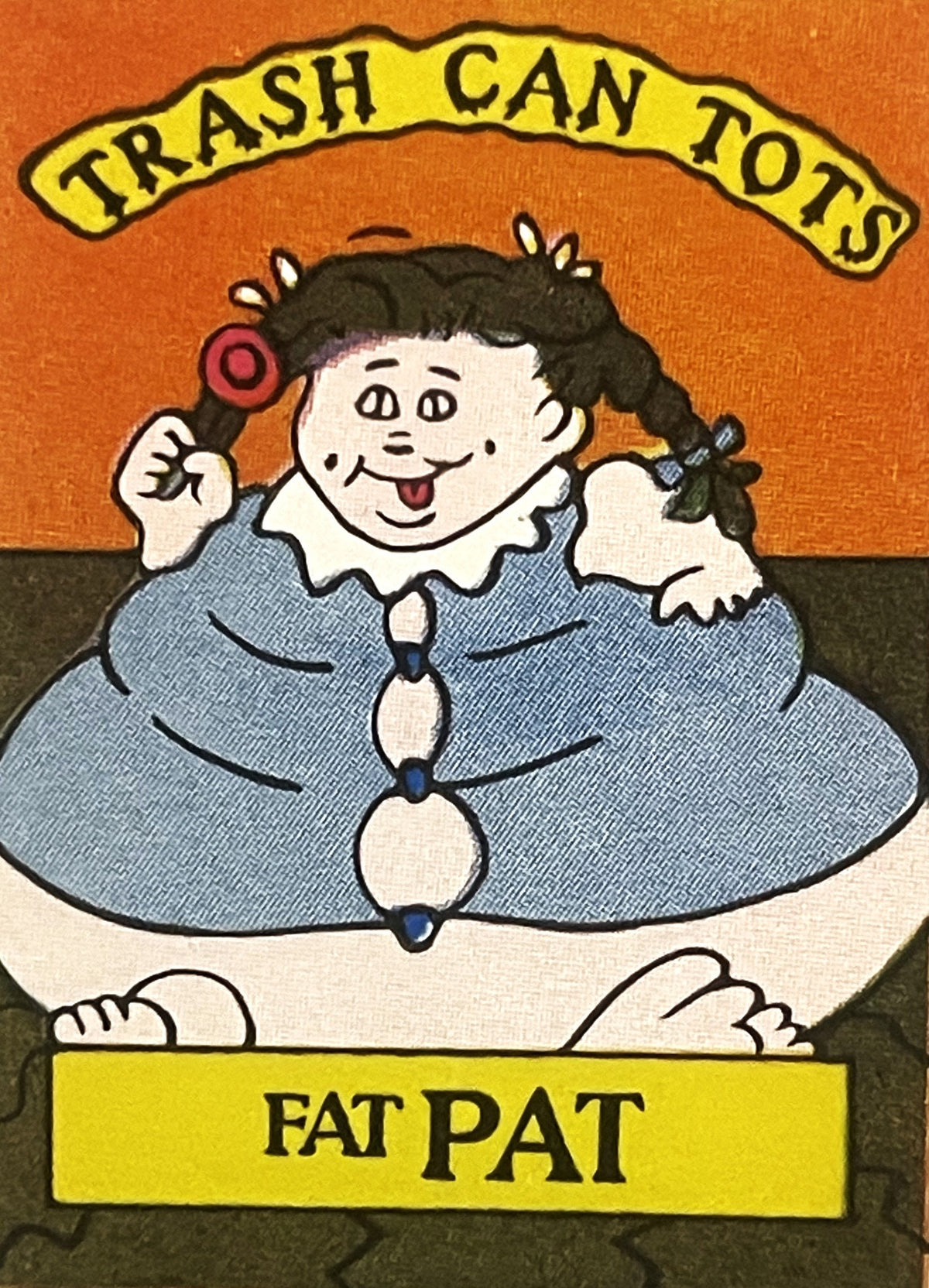 Vintage sticker featuring cartoon character Fat Pat with black pigtails in blue dress, holding a lollipop, against orange bac