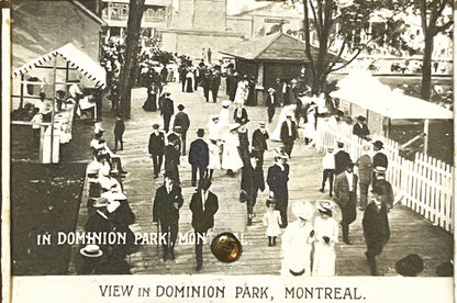 Sepia-toned postcard showing crowded boardwalk scene in Dominion Park, Montreal, with Victorian-era visitors in formal dress,