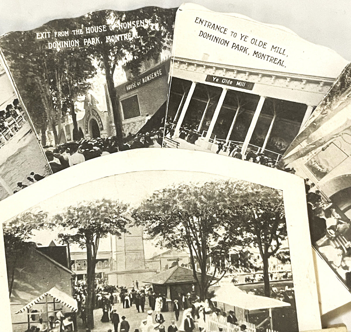 Vintage fan-shaped postcard with three black and white photographs of Dominion Park Montreal, including park entrance and "Ye
