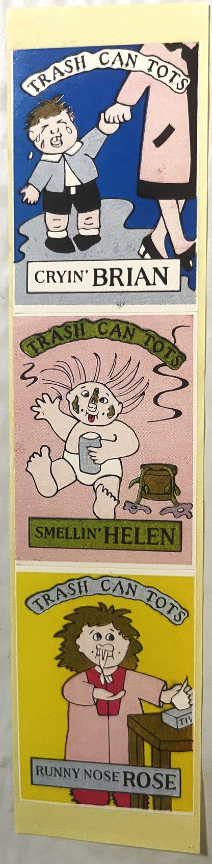 Three sticker panels labeled "Trash Can Tots" featuring cartoon characters: Cryin' Brian, Smellin' Helen, and Runny Nose Rose