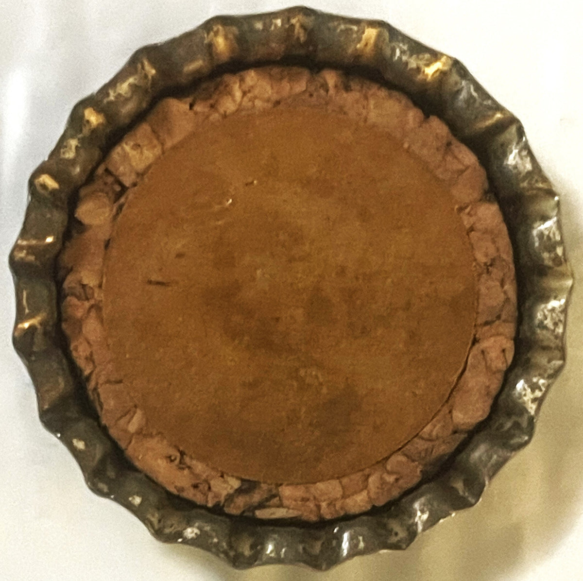 Inside of the Par-T-Pak cap showing the cork liner with its paper spot