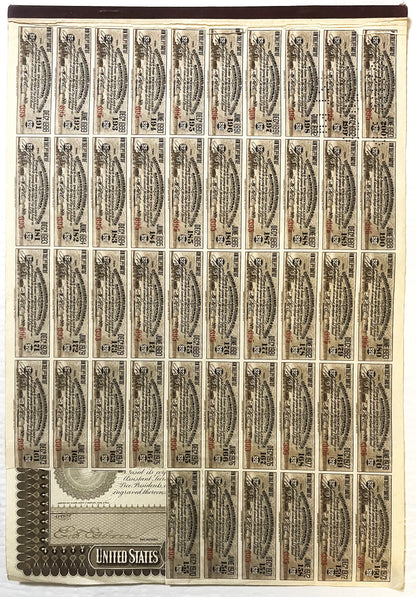 Uncut sheet of approximately 50 vintage $1,000 railroad bond certificates with ornate engravings and attached coupons, displa