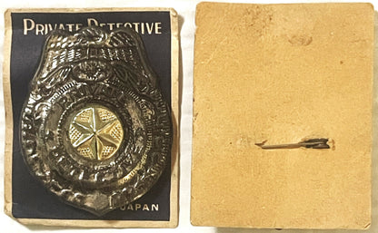 Vintage tin detective badge with eagle emblem on black card labeled "Private Detective" and "Japan," shown front and back on 