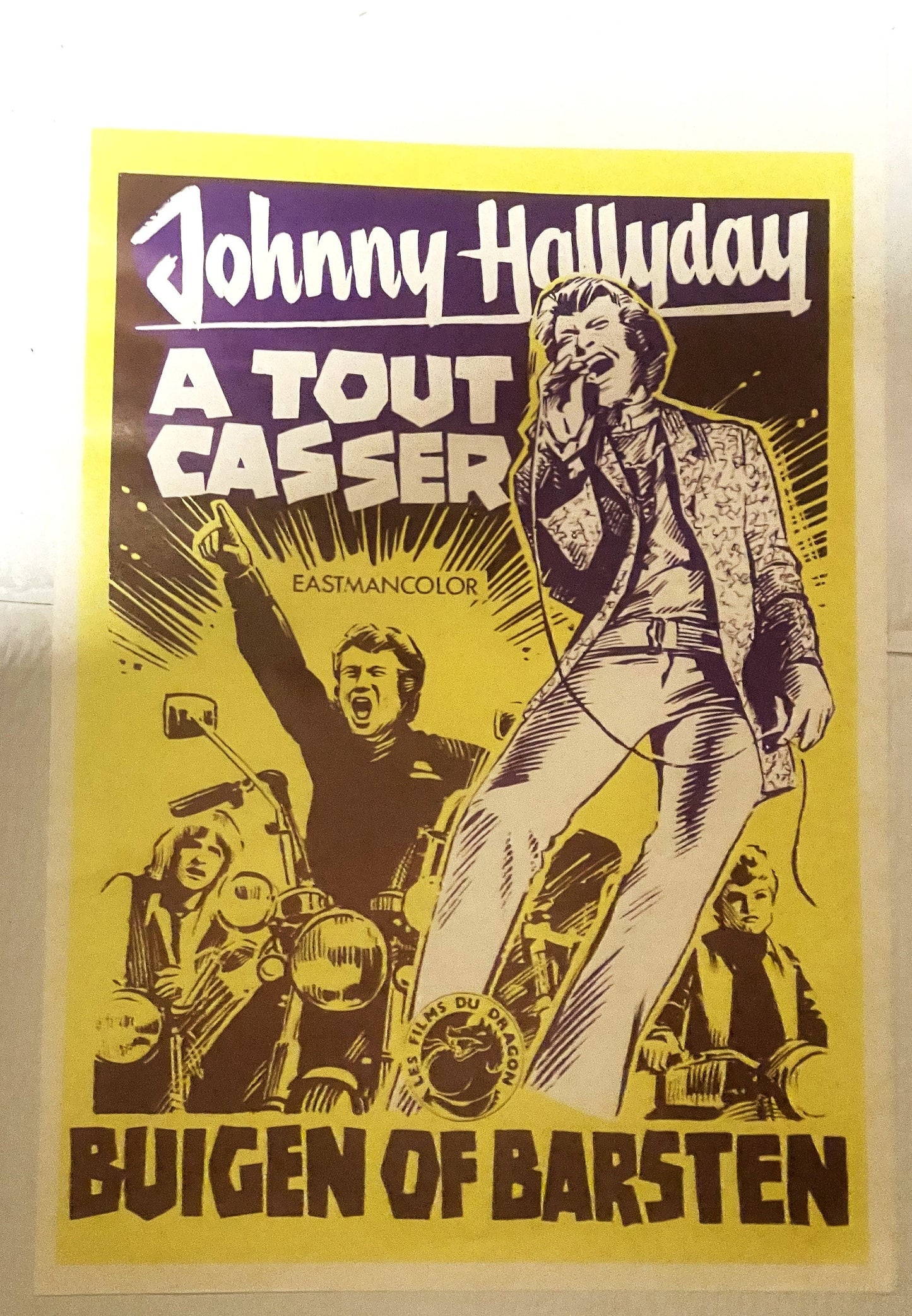 Vintage yellow and brown movie poster for "Johnny Hallyday A Tout Casser" featuring illustrated figures and motorcycles, East
