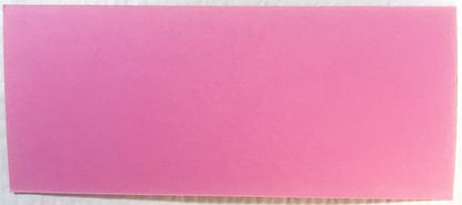 Blank pink ink blotter with slightly worn edges, photographed flat against white background