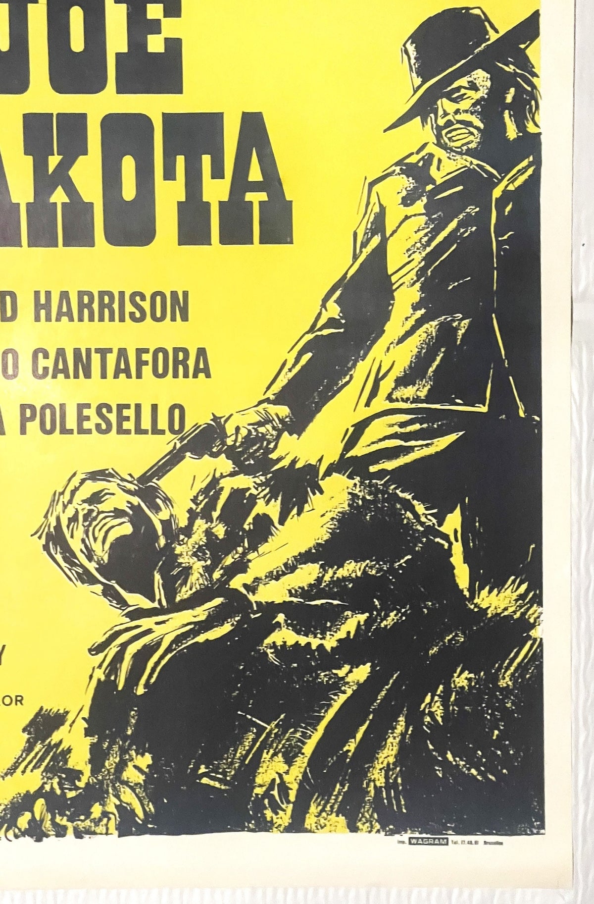 Yellow and black vintage movie poster featuring a cowboy with rifle and hat, text includes "Joe Dakota" and actor names Harri