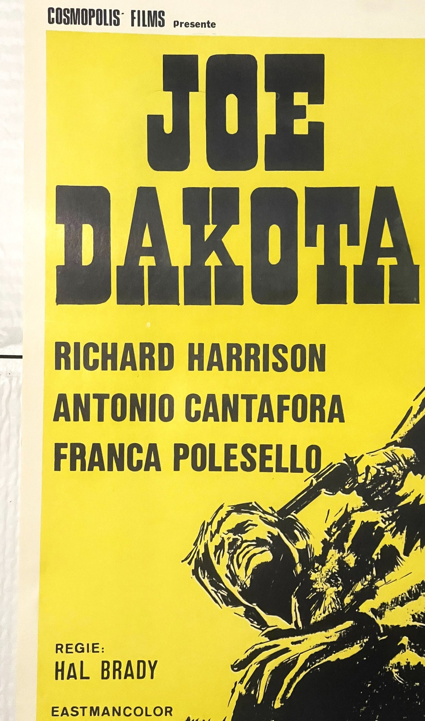 Yellow Belgian movie poster for "Joe Dakota" featuring bold black typography, actor names, director credit, and illustration 