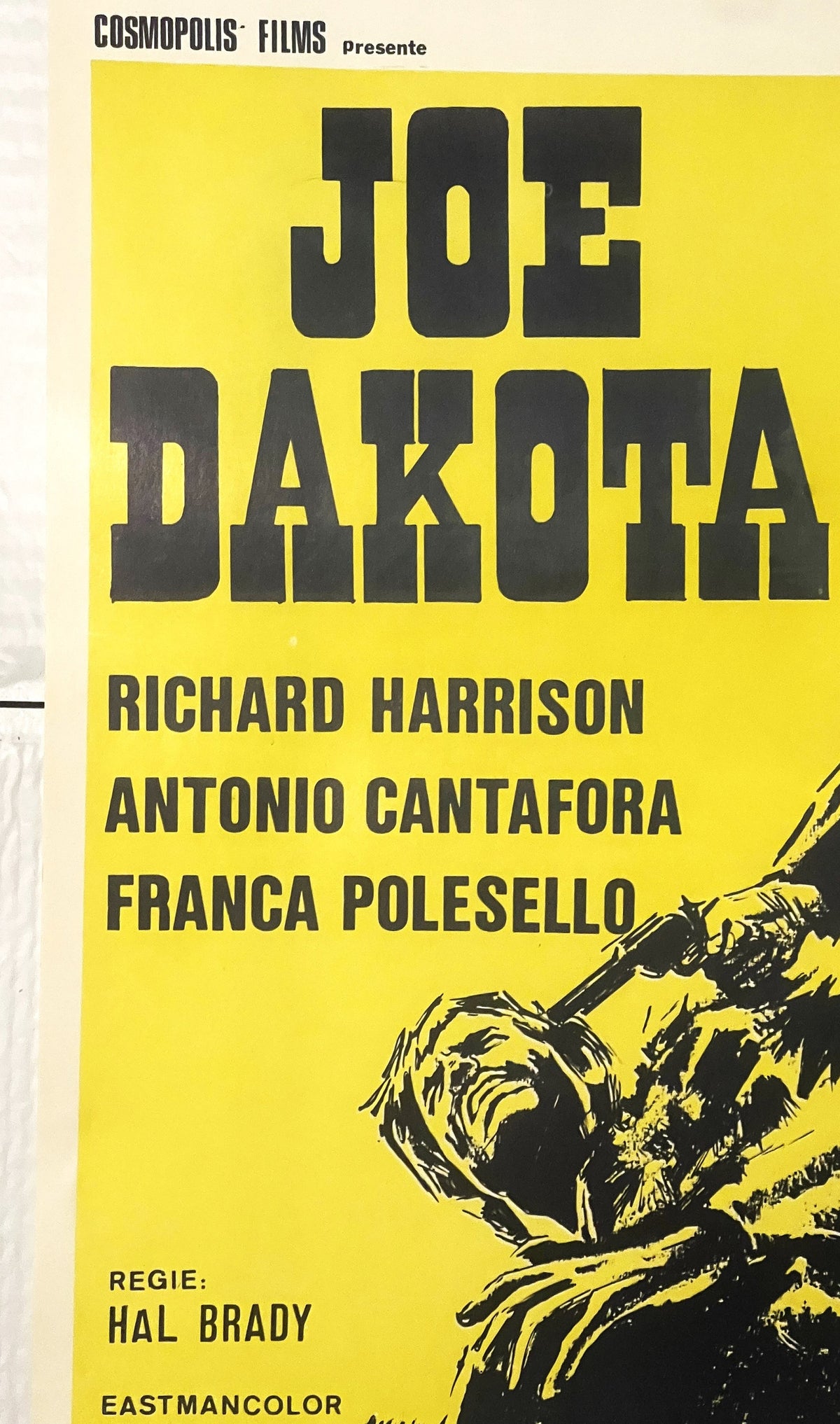 Yellow Belgian movie poster for "Joe Dakota" featuring bold black typography, actor names, director credit, and illustration 