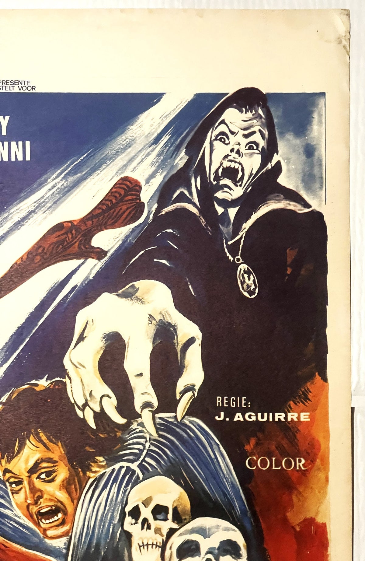 Vintage horror movie poster featuring a vampire character with fangs and cape, skulls, and dramatic blue and red coloring