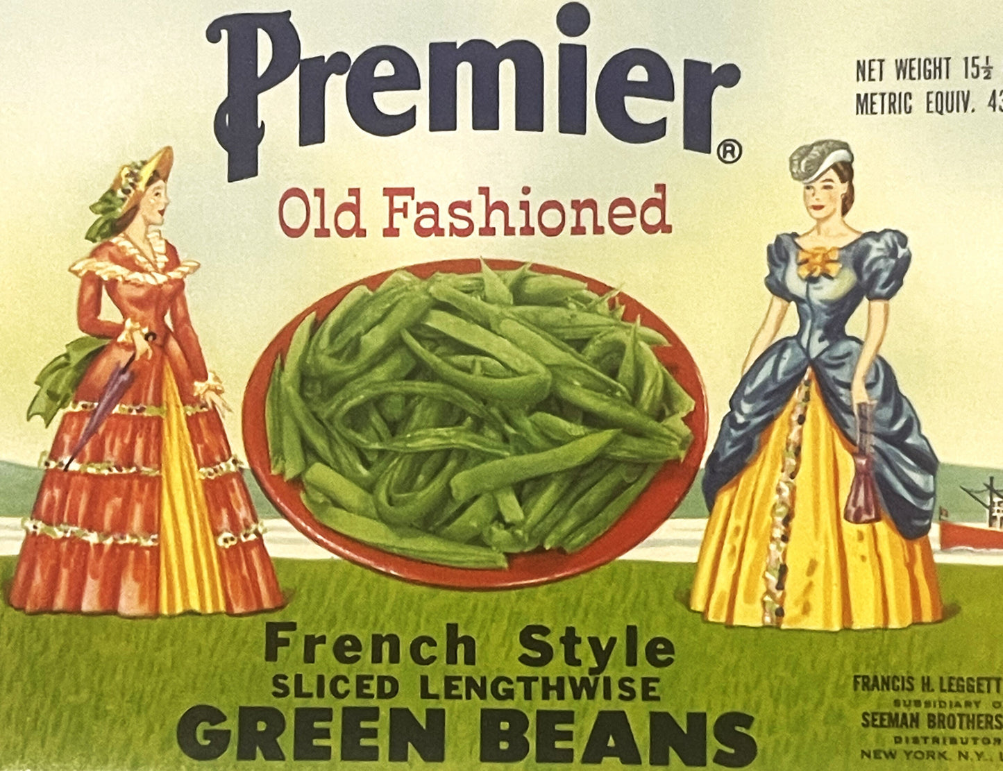 Vintage Premier green beans can label featuring two Victorian ladies in elaborate period dresses flanking a red bowl of slice